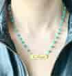 TURQUOISE NECKLACE WITH A TAG IN ARABIC "I love you "